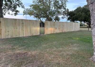 Wood privacy fence around a large yard